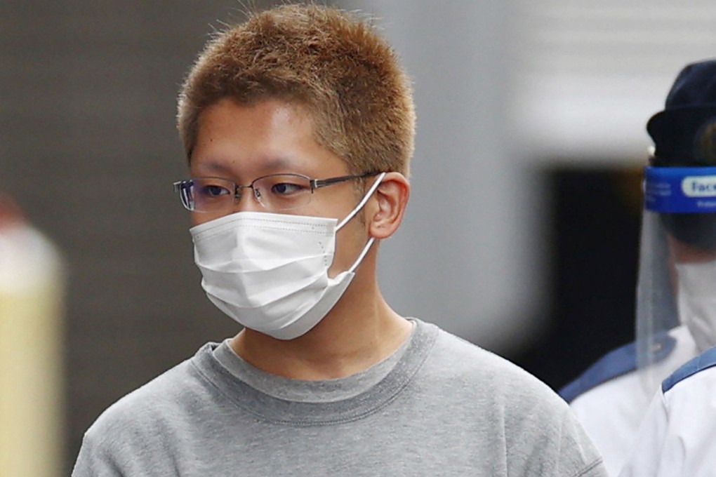 Kyota Hattori is escorted to the prosecutor’s office in Tokyo on November 2, 2021. Hattori was sentenced to 23 years for stabbing a passenger, and setting a fire on a Tokyo train. Photo: AFP