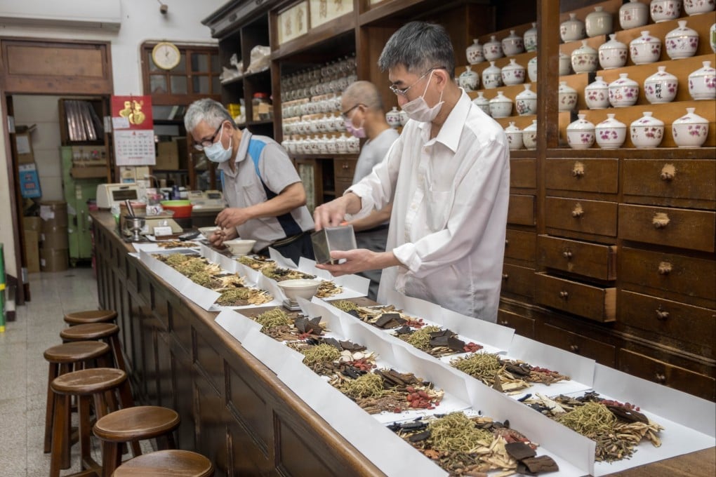 Traditional Chinese medicine (TCM) practitioners sort herbal preparations. Astragalus root, used in TCM, has been found to reduce inflammation in heart attack patients in a UK study. Photo: Shutterstock