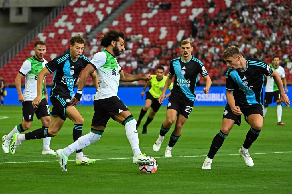 Liverpool’s Egyptian forward Mohamed Salah dribbles through the Leicester City defence during their game in Singapore on Sunday. Photo: AFP