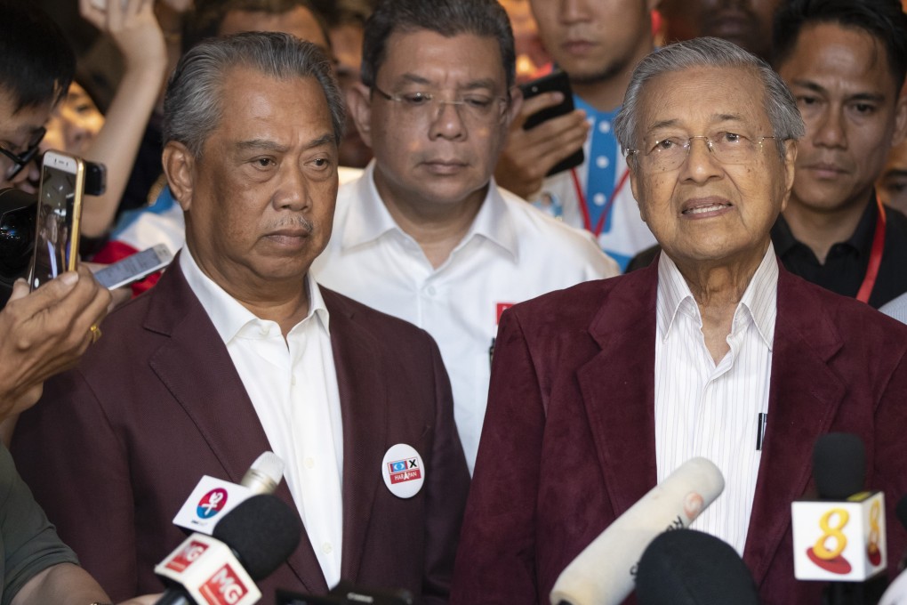 Muhyiddin Yassin and Mahathir Mohamad pictured at a press conference in 2018. It appears as if the two Malaysian ex-prime ministers have buried the hatchet – amid a warning that Islamist PAS “will stab them first”. Photo: AP