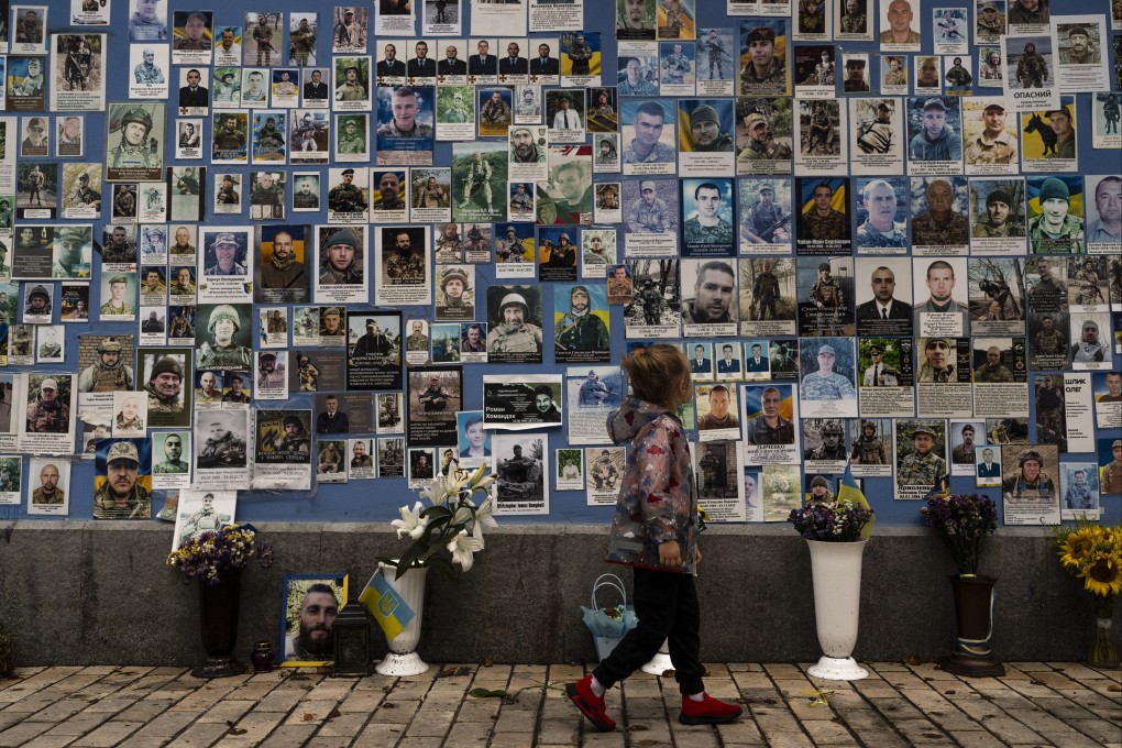 Photos of Ukrainian soldiers killed in the county’s war against Russia, at the Wall of Remembrance in Kyiv, Ukraine. Photo: AP