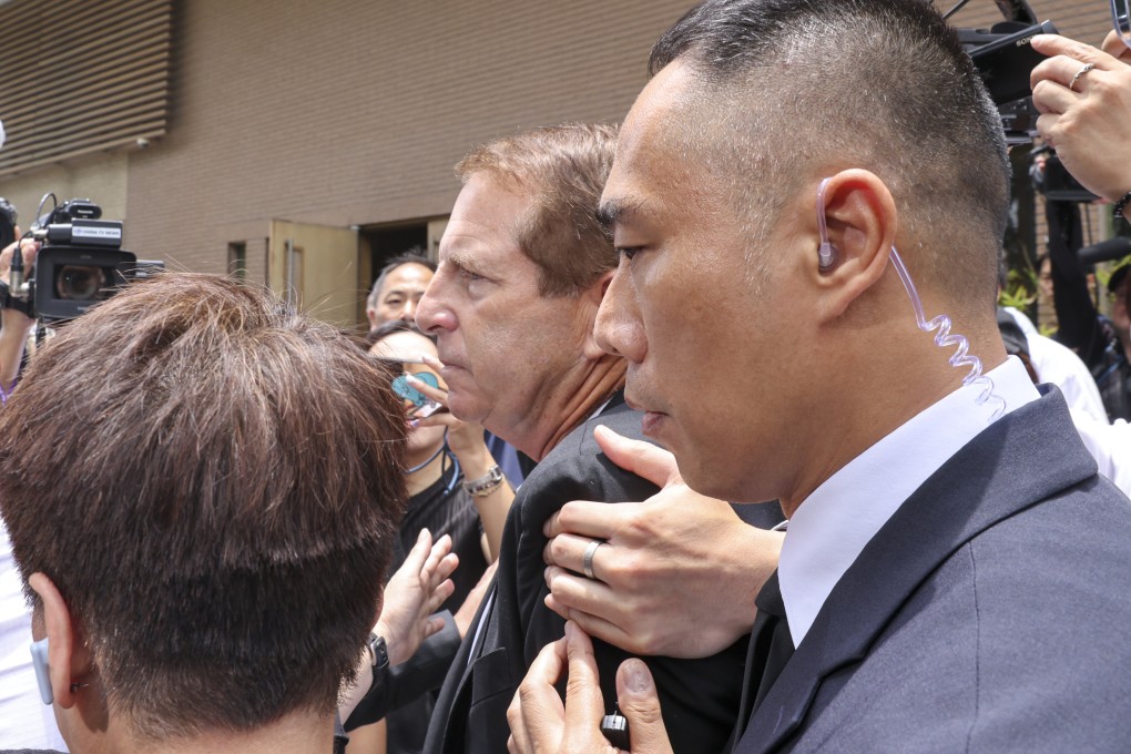 Angry fans confront late pop diva Coco Lee’s estranged husband Bruce Rockowitz. Photo: Yik Yeung-man