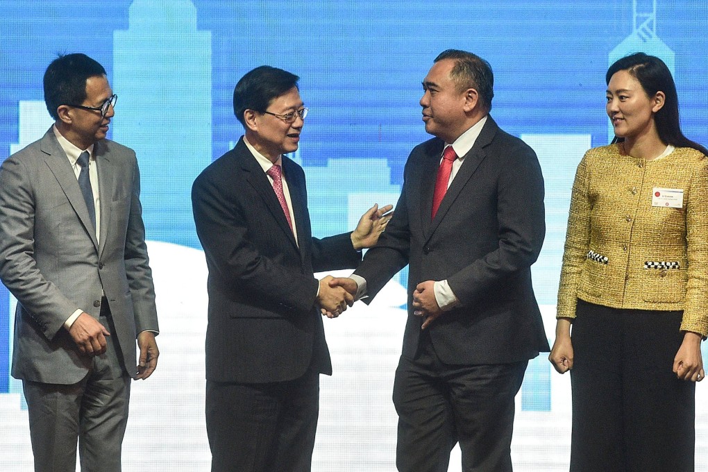 Hong Kong’s Chief Executive John Lee (second from left) shakes hand with Malaysia’s Minister of Transport Anthony Loke (second from right) during a ceremony for “Malaysia - Hong Kong Partnering for Success in Kuala Lumpur” on Friday. Photo: AFP
