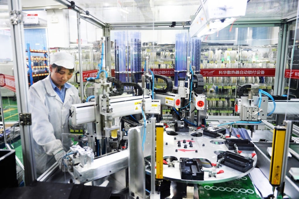 A worker processes circuit boards at a workshop of a private enterprise in Zhangzhou, Fujian province, on June 19. In its effort to revitalise China’s economy, the central government has thrown its support behind the private sector and encouraged entrepreneurs to do their part to support the country. Photo: Xinhua