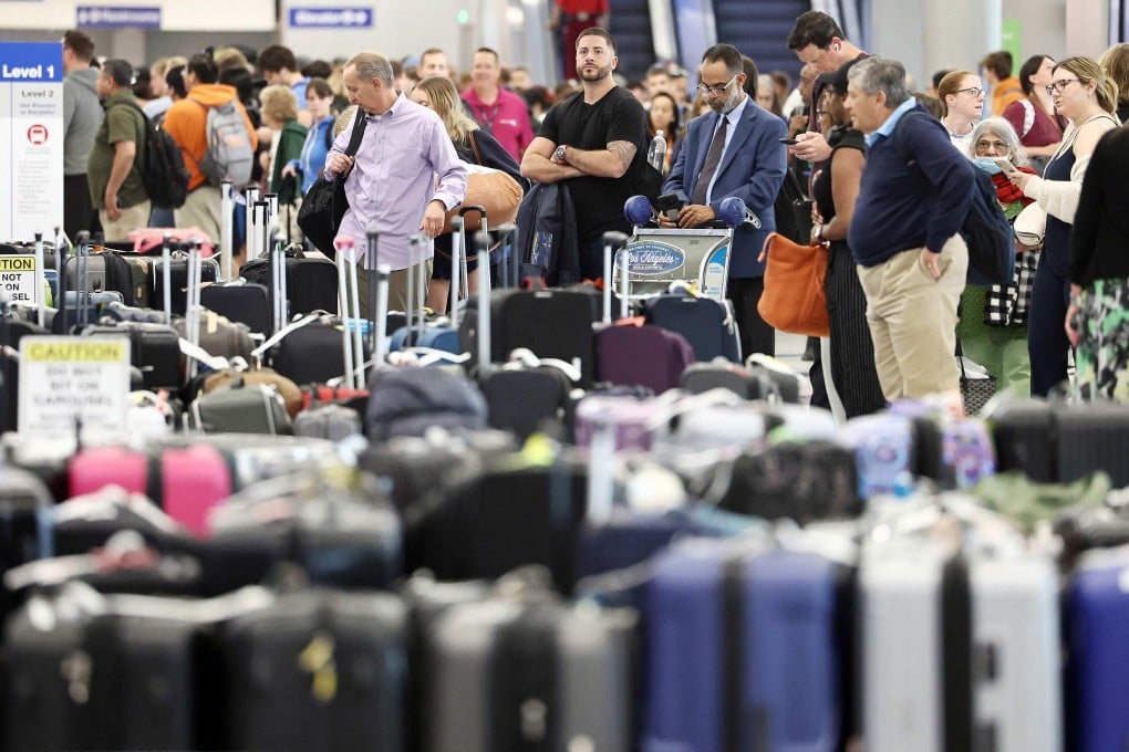 Travellers wait for their bags amid rows of unclaimed luggage at the United Airlines baggage claim area at Los Angeles airport on June 29, amid flight cancellations and delays. CEO Scott Kirby could have shown remorse by donating to a charitable fund in honour of affected United passengers and employees, or dedicating a pay cut to employees. Photo: Getty Images via AFP