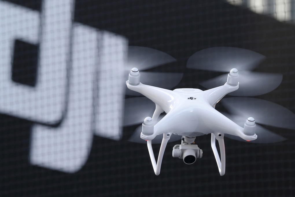 A Phantom 4 drone from DJI flies during a demonstration flight in Tokyo,  March 3, 2016. Photo: AP