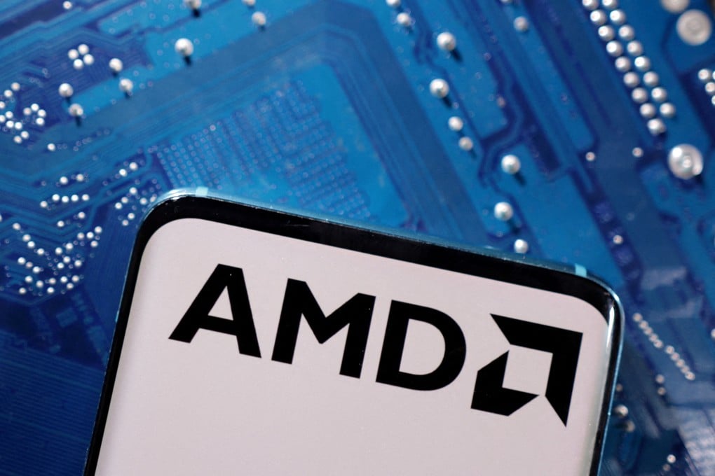 A smartphone with a displayed AMD logo placed on a computer motherboard in this illustration taken March 6, 2023. Photo: Reuters