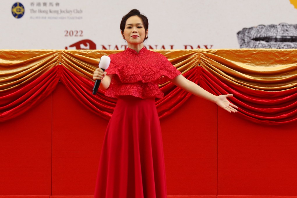 Hong Kong soprano Phoebe Tam Lok-hin leads the singing of the national anthem during National Day celebrations at Sha Tin Racecourse in October 2022. Photo: Kenneth Chan.