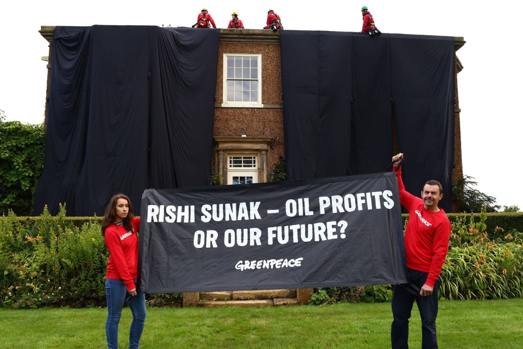 Greenpeace activists climb onto the roof of the UK Prime Minister’s house on Thursday in protest at his backing for a major expansion of North Sea oil and gas drilling amidst a summer of escalating climate impacts. Photo: Greenpeace UK/Handout/AFP