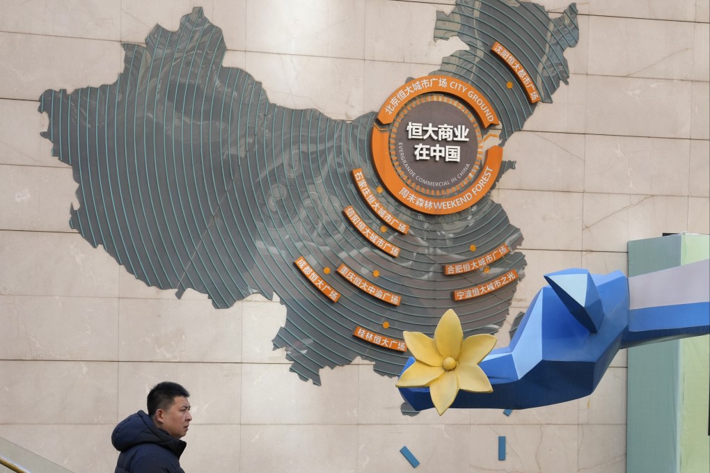 A map depicting China Evergrande’s projects are displayed at a mall in Beijing. The company’s property services arm resumed trading in Hong Kong after 16 months. Photo: AP Photo