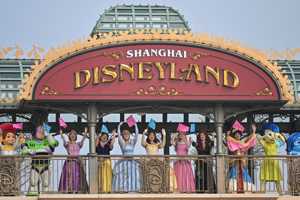 Performers dressed as Disney characters are seen at the Disneyland amusement park in Shanghai, May 11, 2020. Photo: AFP