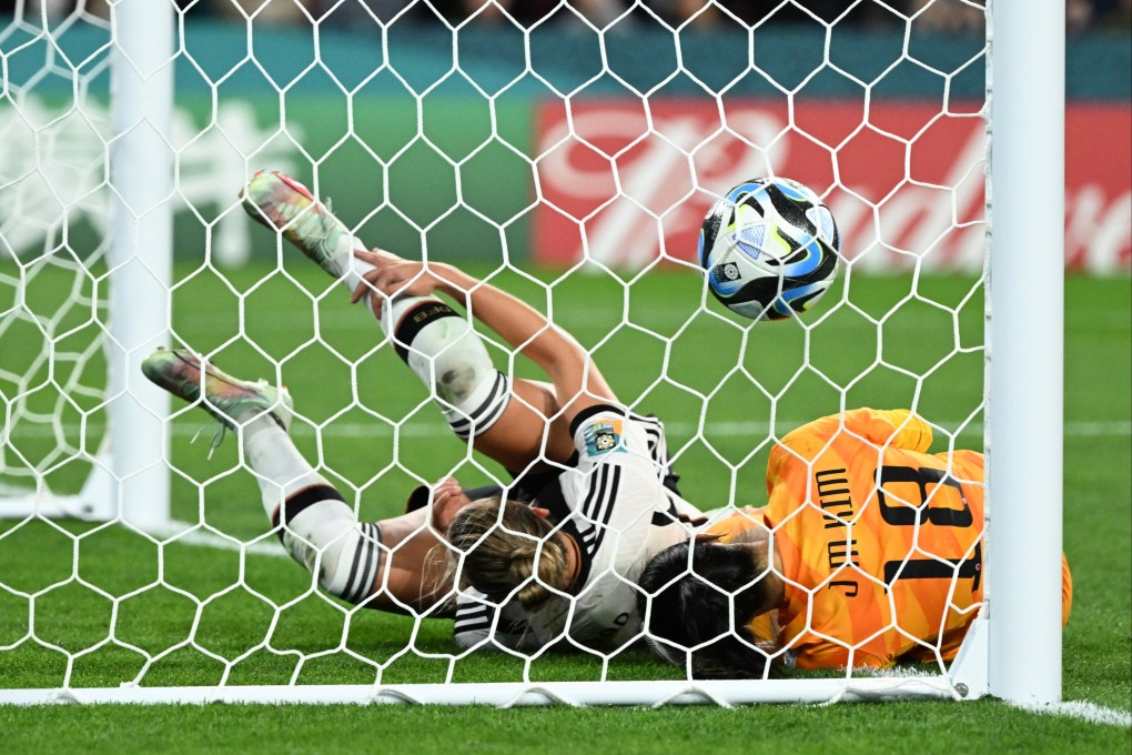 Alexandra Popp (left) of Germany collides with South Korean goalkeeper Jungmi Kim in Brisbane, Australia. Photo: EPA-EFE