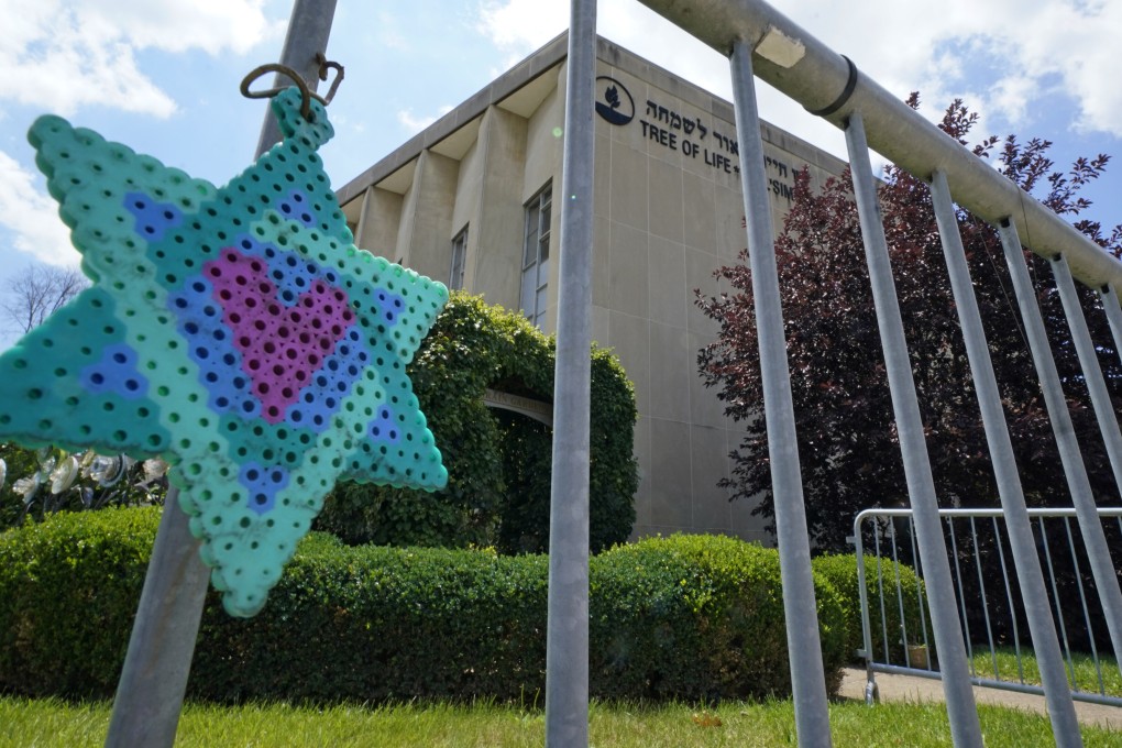 A Star of David hangs from a fence outside the dormant landmark Tree of Life synagogue in Pittsburgh in July. Photo: AP