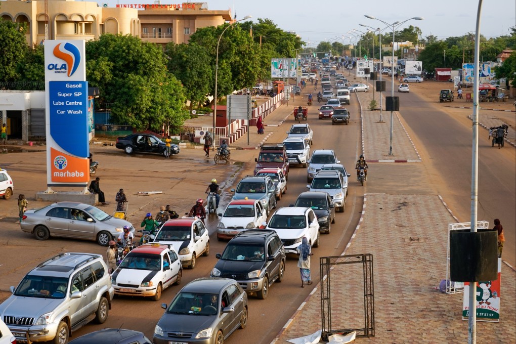 Cars drive along a main road in Niamey on Wednesday. Photo: EPA-EFE