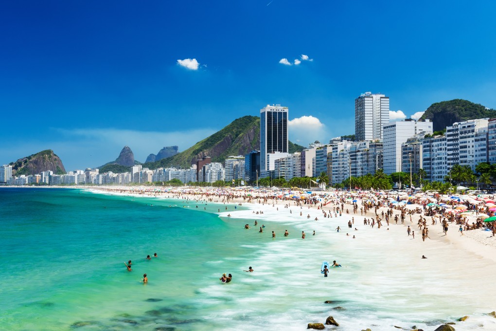 Copacabana Beach in Rio de Janeiro, Brazil. Rio is one of many great cities around the world where you can combine a beach holiday with urban exploration. Photo: Shutterstock