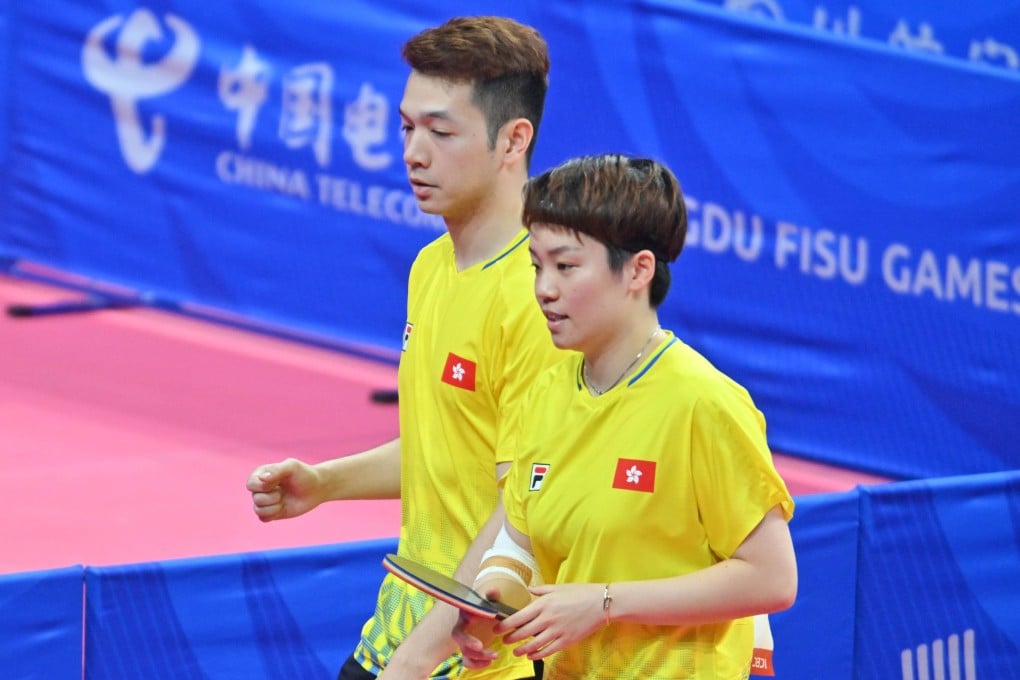 Doo Hoi-kem (right) sports a bandaged arm in the mixed doubles. Photo: USFHK