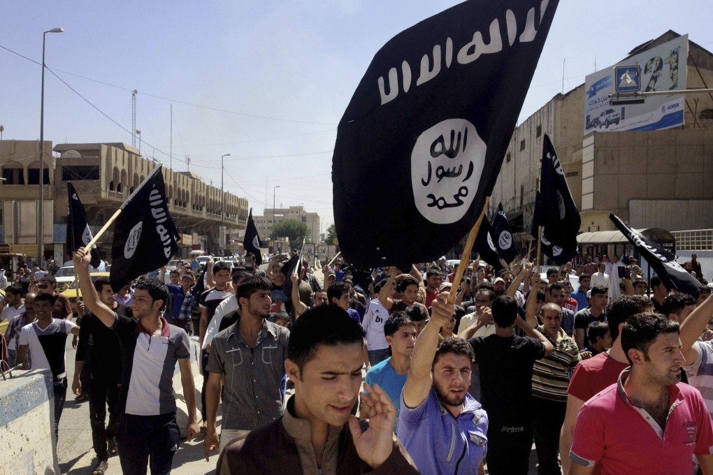 Demonstrators chant pro-Islamic State group slogans in Mosul, Iraq, in June. Photo: AP