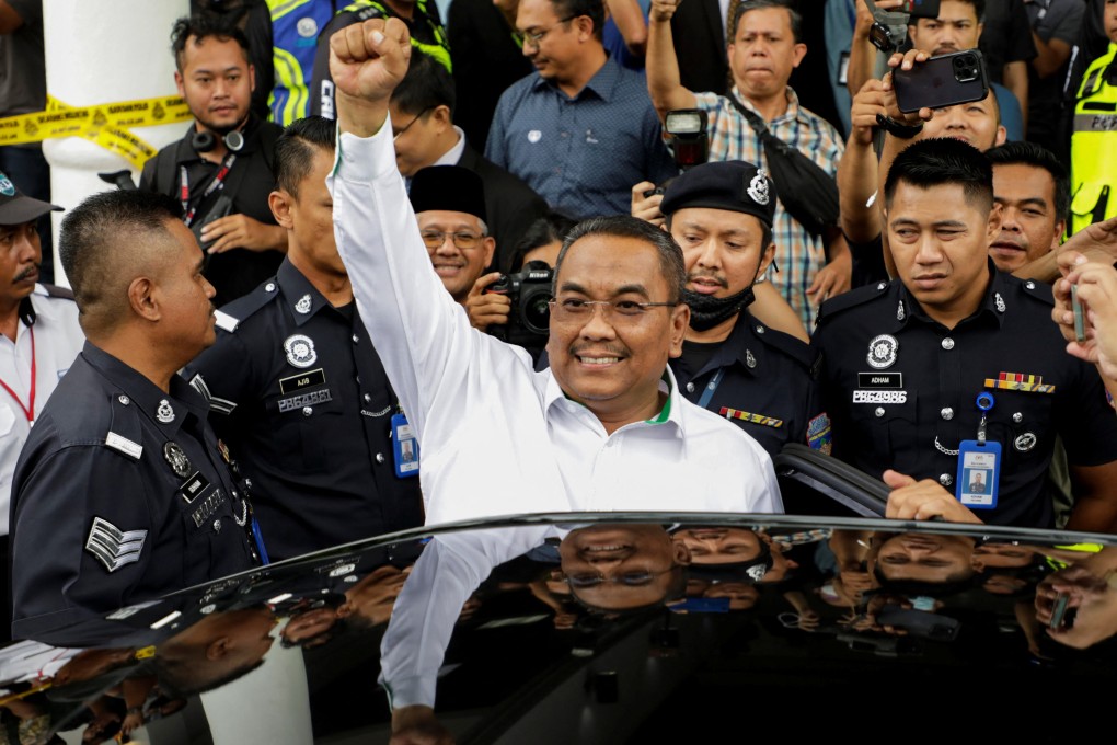 Malaysian opposition leader Muhammad Sanusi Md Nor raises his fist as he leaves a court where he was charged in Gombak, Malaysia on July 18. His decision to ban gambling and clamp down on alcohol has made him very popular in a state where more than 80 per cent of people are Muslims. Photo: Reuters