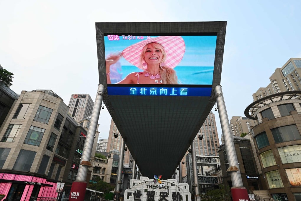 A trailer for the movie “Barbie” is shown on a giant screen outside a shopping mall in Beijing on July 20. Photo: AFP