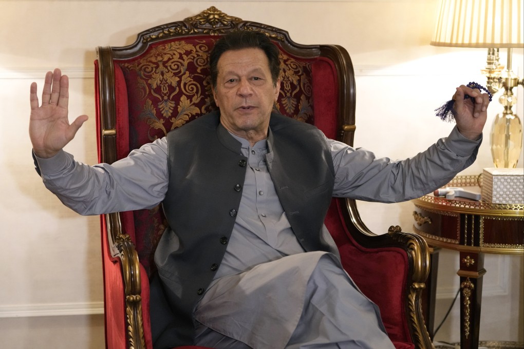 Pakistan’s former prime minister Imran Khan talking with reporters at his residence, in Lahore on August 3. Photo: Reuters