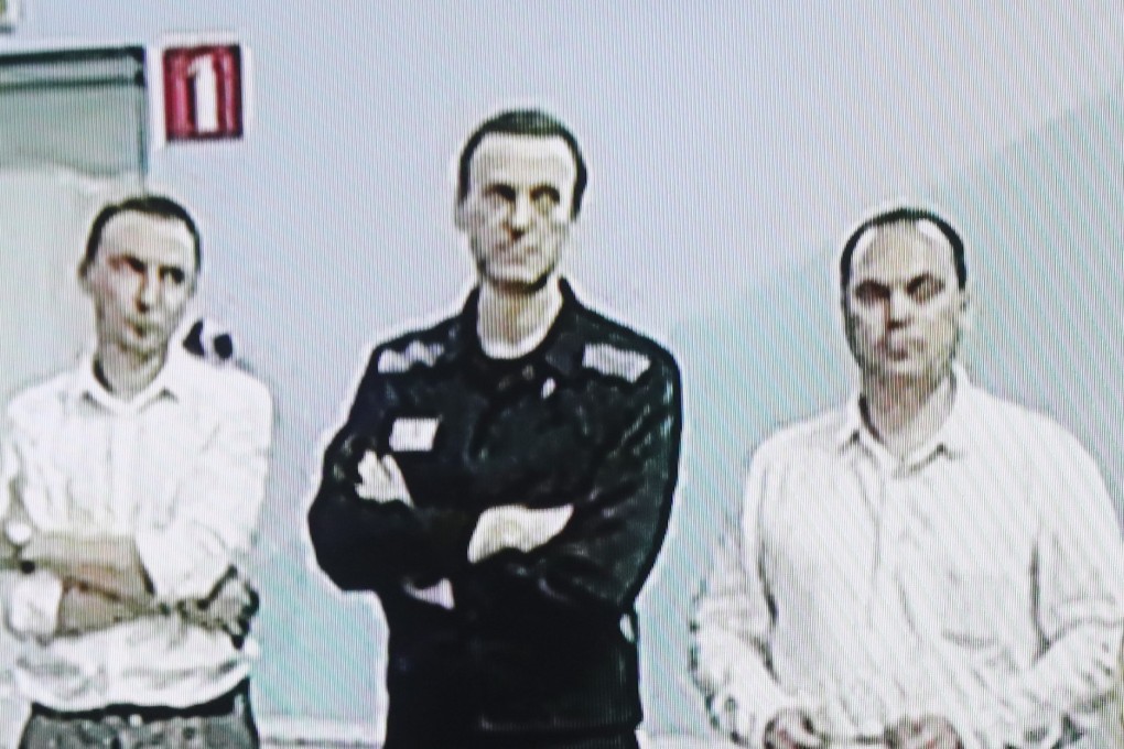 Russian opposition figure Alexei Navalny is seen second from left on a screen at the Moscow city court. Photo: EPA-EFE