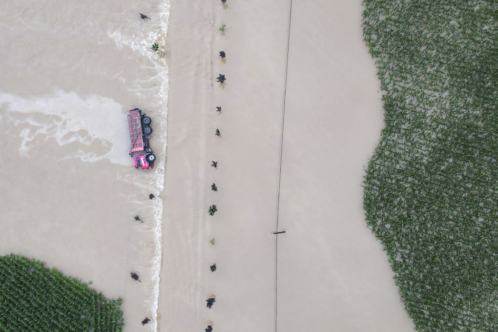 Authorities in the city of Shulan, Jilin province say their next task is to repair roads, bridges, electricity infrastructure and telecommunications stations damaged by heavy rain and floods. Photo: Xinhua via AP