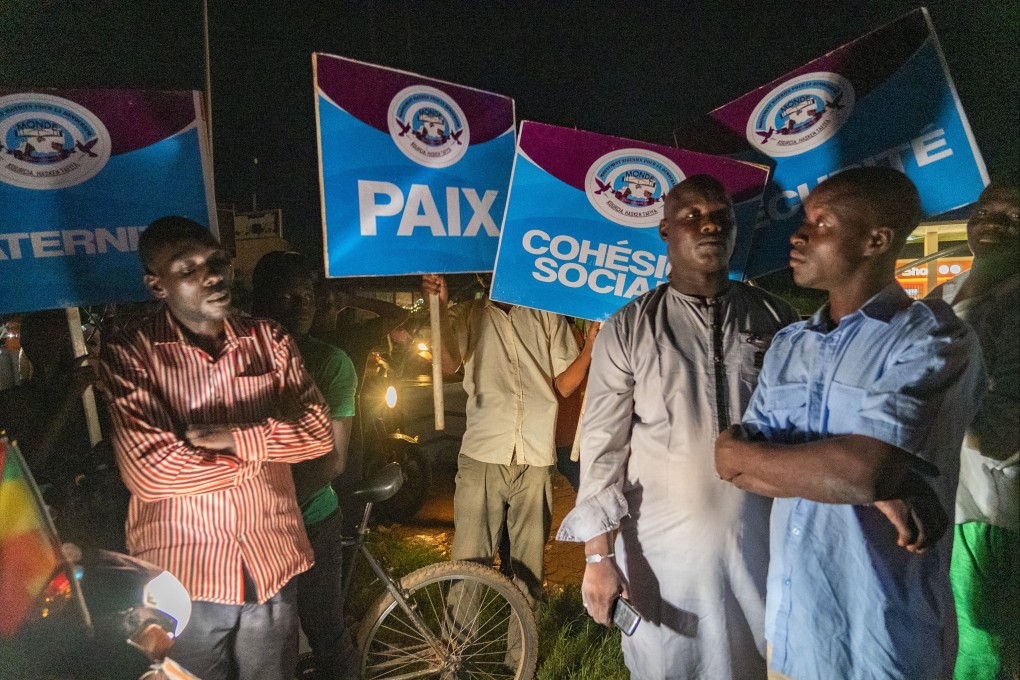 Supporters of Niger’s ruling junta, accompanied by some security forces, in Niamey early on Sunday. Photo: AP