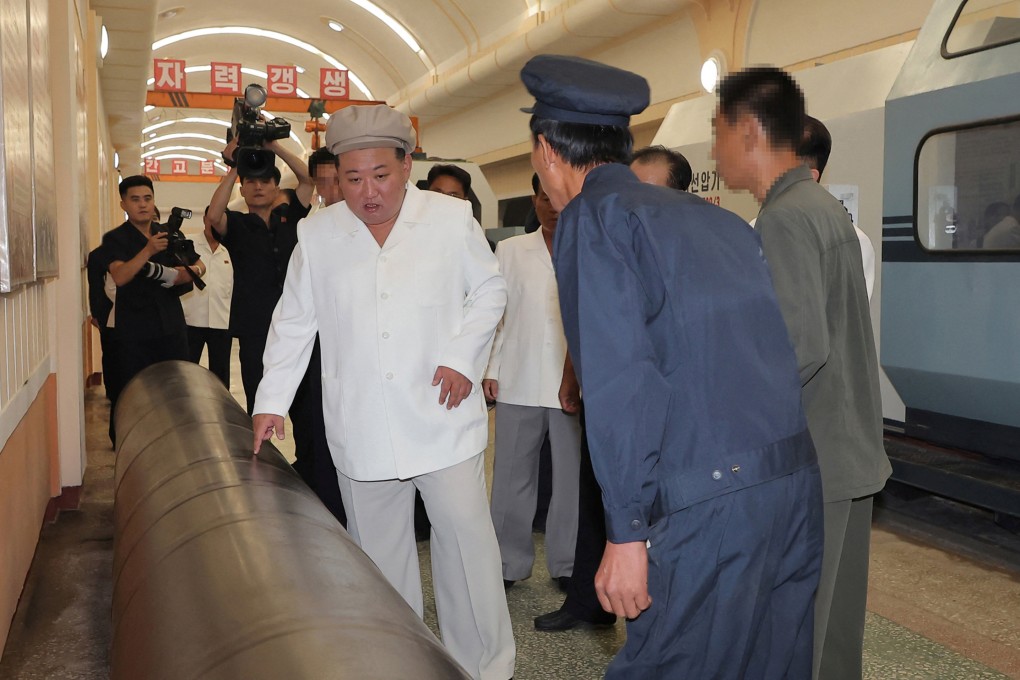 North Korean leader Kim Jong Un visiting a weapons factory on Sunday. Photo: via Reuters