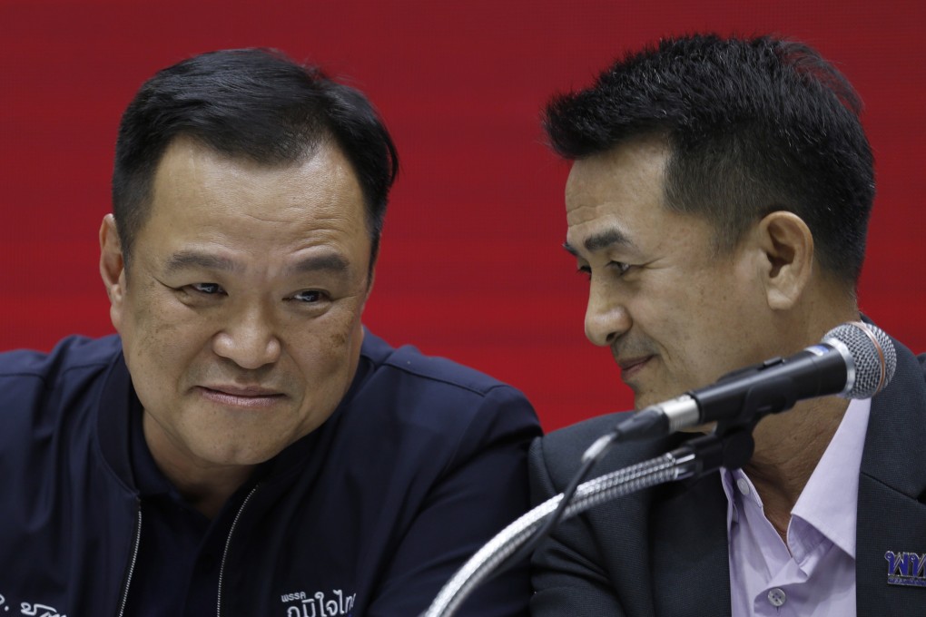 Bhumjaithai Party leader Anutin Charnvirakul (L) and Pheu Thai Party leader Cholnan Srikaew at a press conference in Bangkok on Monday. They announced they would form a coalition government, which does not include May election winner the Move Forward Party. Photo: EPA-EFE