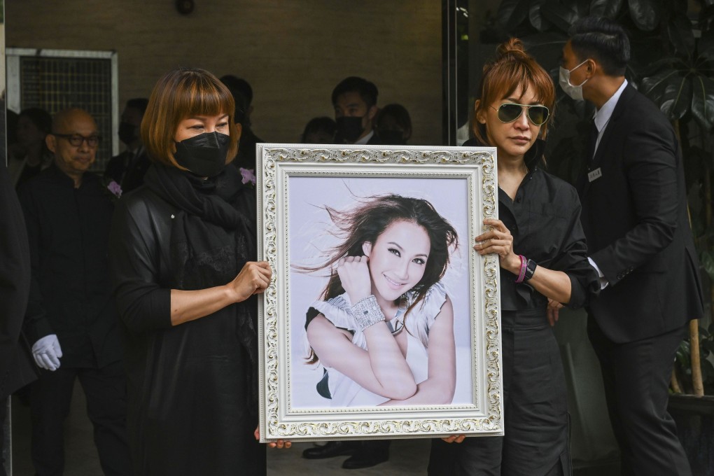 Relatives hold a photo of Coco Lee after her funeral in Hong Kong on August 1. Lee’s death has sparked a renewed focus on mental health in Hong Kong. Photo: AP