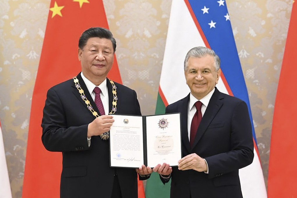 Uzbekistan President Shavkat Mirziyoyev (right) poses with President Xi Jinping after awarding him the Order of Holy Friendship before the Shanghai Cooperation Organisation summit in Samarkand, Uzbekistan, in September 2022. Bilateral trade and Chinese investment in Uzbekistan have risen steadily in recent years as Uzbekistan purses a raft of reforms in its modernisation efforts. Photo: EPA-EFE