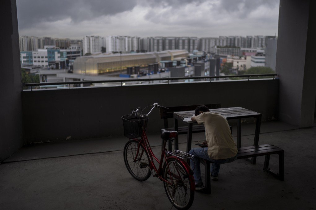 A worker takes a break in a communal area of an office building in Singapore last month. The location of the electronics-company office involved in the court case is Pantech Business Hub. Photo: AP