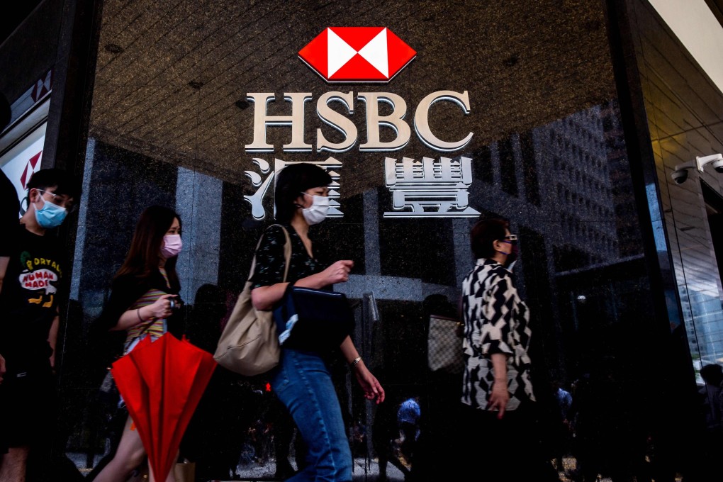 Pedestrians walk past the HSBC logo outside a bank branch in Hong Kong in August 2021. Photo: AFP