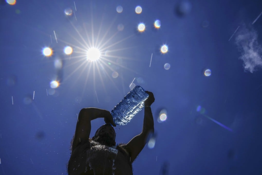 A man pours cold water onto his head to cool off on a sweltering hot day in Beirut, on July 16. Europea’s climate monitoring organisation made it official: July was Earth’s hottest month on record, by a wide margin. Photo: AP