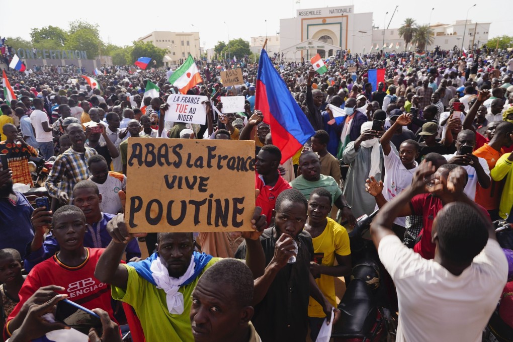 Russian flags can be seen among Nigeriens participating in a march called by supporters of coup leader General Abdourahmane Tchiani in Niamey, Niger. Photo: AP