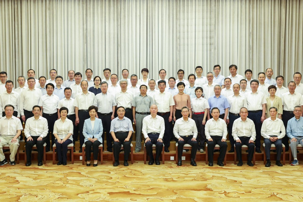 Cai Qi (front row, centre), the president’s chief of staff, meets experts invited to the Beidaihe summer gathering in Hebei province on Thursday. Photo: Xinhua