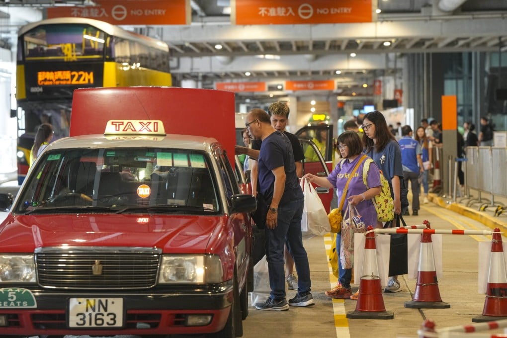 Passengers load their bags into a taxi at the Kai Tak Cruise Terminal on August 9. The terminal operator has called for more robust transport options to accommodate cruise passengers after reports of long queues of people waiting for taxis. Photo: Sam Tsang