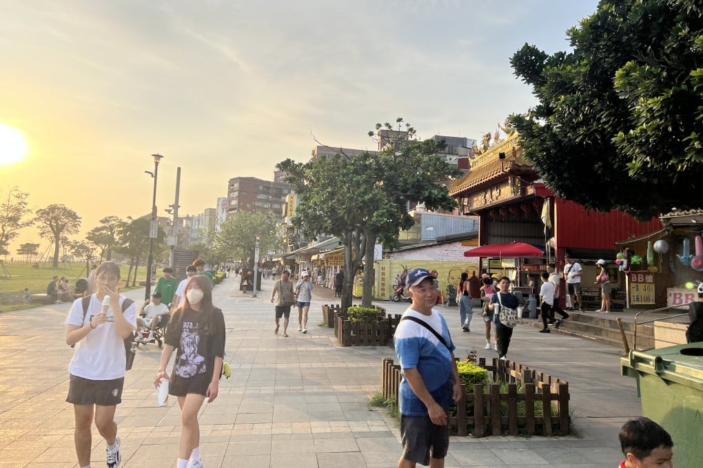 Shoppers and sunset gazers emerge in the tourist zone of Danshui, Taiwan, on Monday. Photo: Ralph Jennings