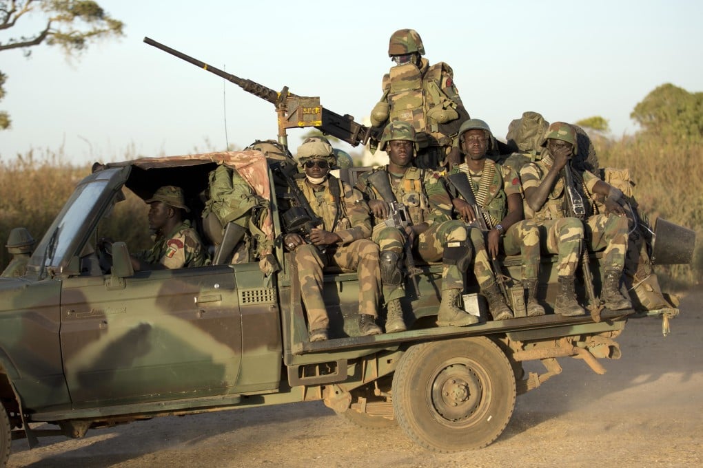 ECOWAS Senegalese troops in Gambia in 2017. The West African bloc has threatened to use force to reinstate the president of Niger. File photo: AP