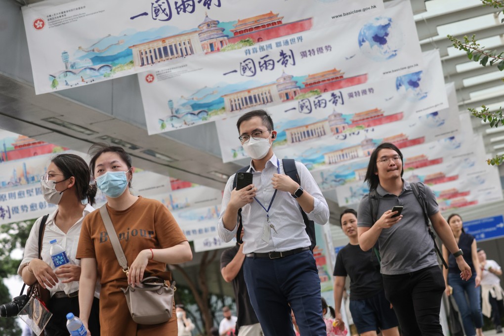 Civil servants leave the Central Government Offices in Tamar after work. The perception of Hong Kong government jobs being as secure as an “iron rice bowl” does nothing for the management of a modern administration. Photo: May Tse