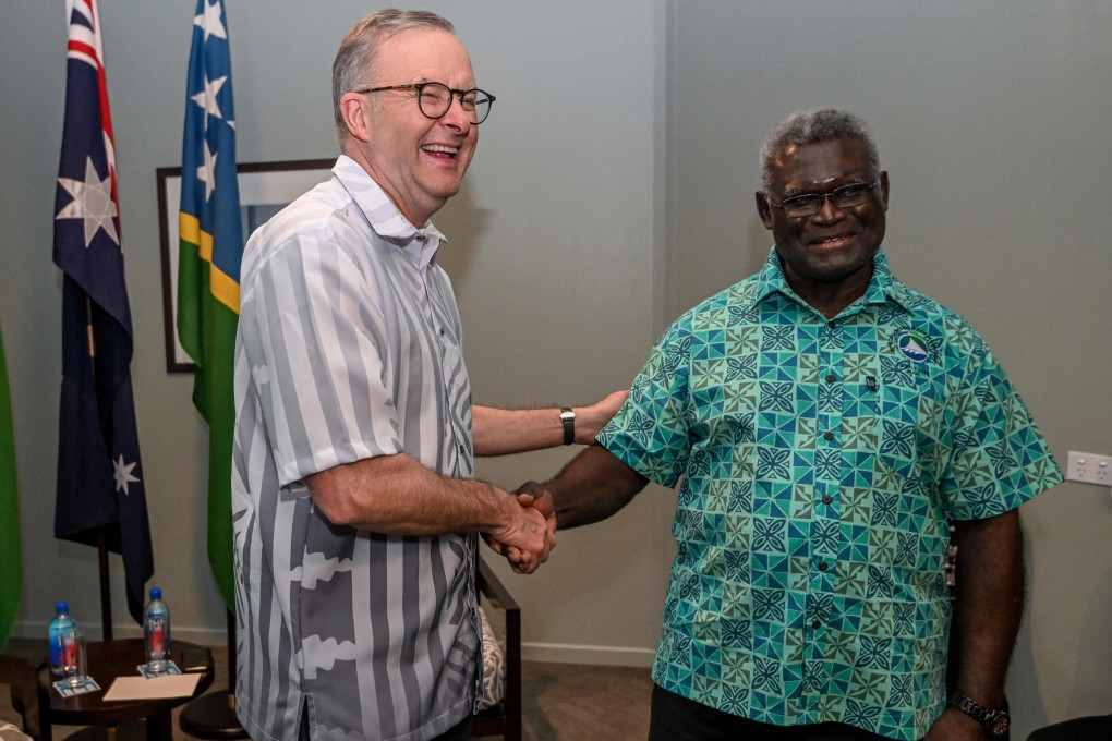 Australia’s Prime Minister Anthony Albanese (L) greets Solomon Islands Prime Minister Manasseh Sogavare in Suva on July 13, 2022. Photo: AFP