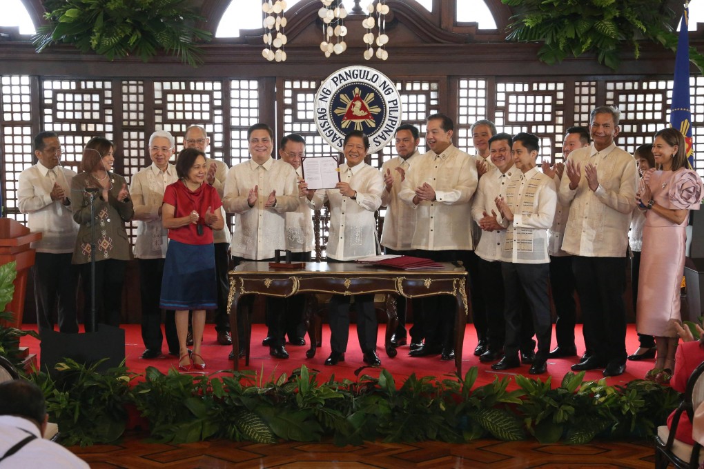 Philippines President Ferdinand Marcos Jnr (centre) after signing the Maharlika sovereign wealth fund into law at the Malacanang Palace in Manila. Photo: Philippines Presidential Photographers Association/AFP
