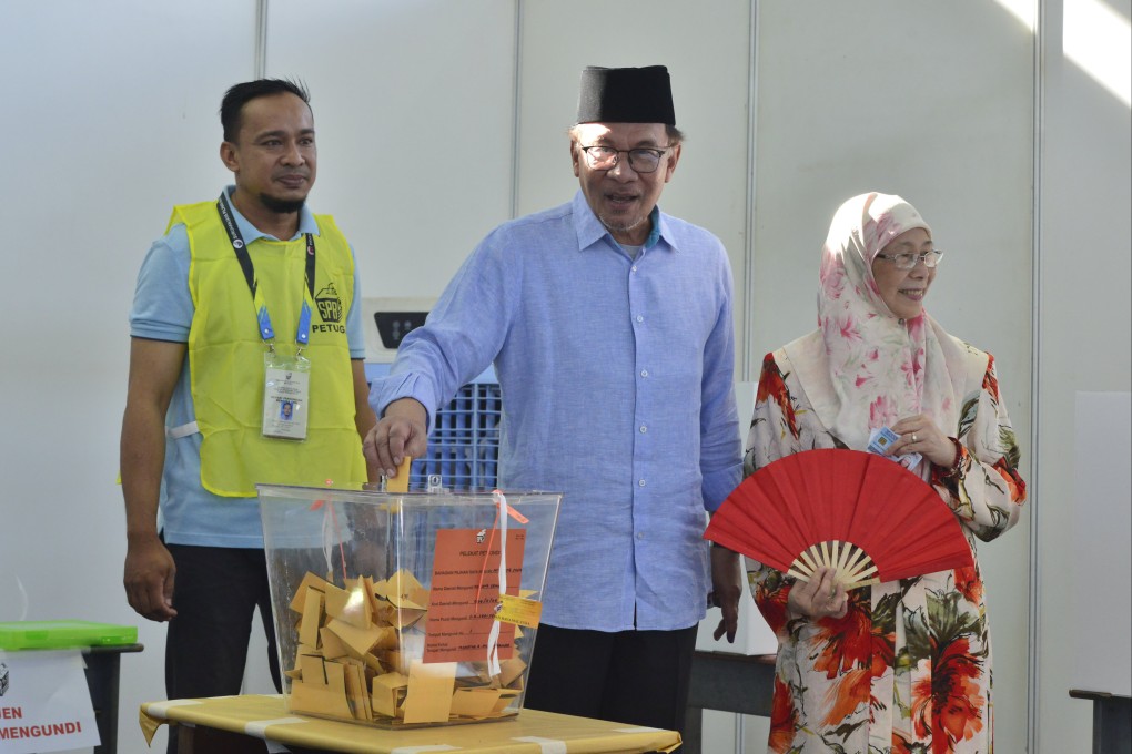 Malaysian Prime Minister Anwar Ibrahim casts his vote at a polling station in Seberang Perai, Penang, on Saturday. Photo: AP