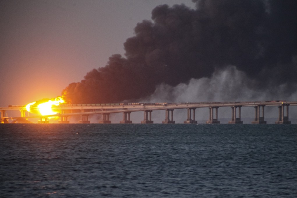 Flames and smoke rise from the Crimean Bridge connecting the Russian mainland and Crimean peninsula over the Kerch Strait. Photo: AP