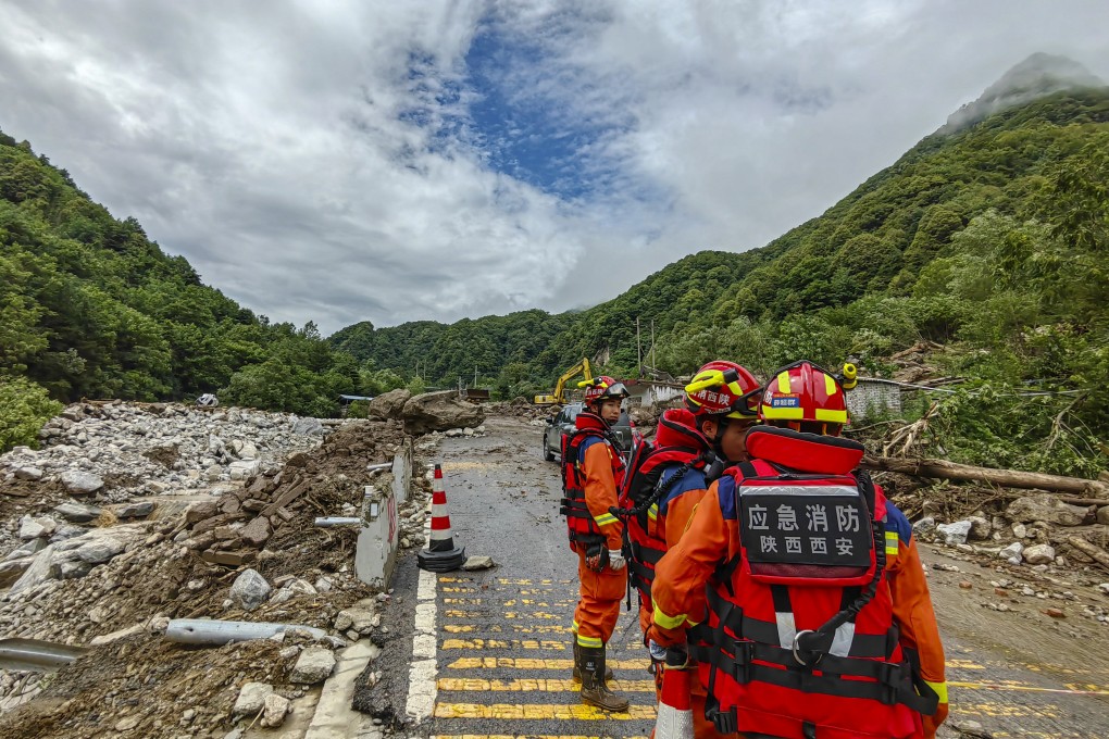 Rescue crews work in a mountain village near Xian in northwestern China, where floods and mudslides washed away houses and damaged roads, bridges and power facilities. Photo: Xinhua