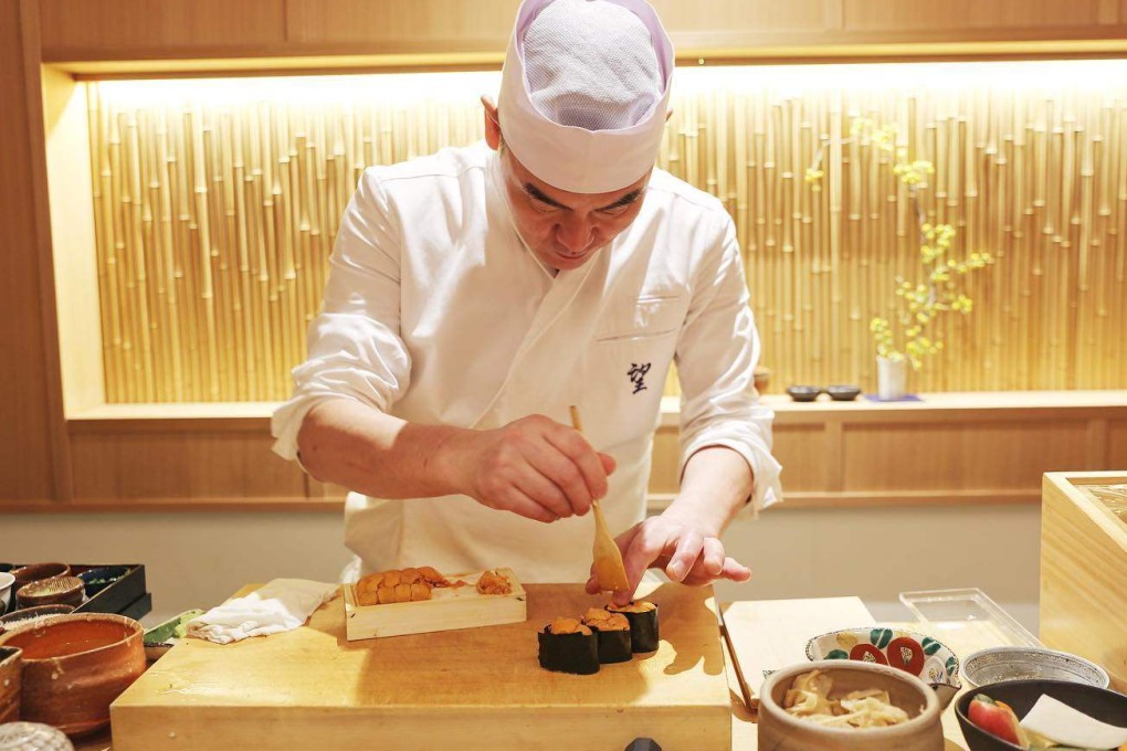 A chef prepares uni nigiri at Noz Market in New York, opened as an “entry point to the world of high-end omakase without the intimidating price tag”. Chef’s choice meals cost US$140 there. High-end sushi restaurants in the city are closing. Photo: Instagram/@nozmarketnyc