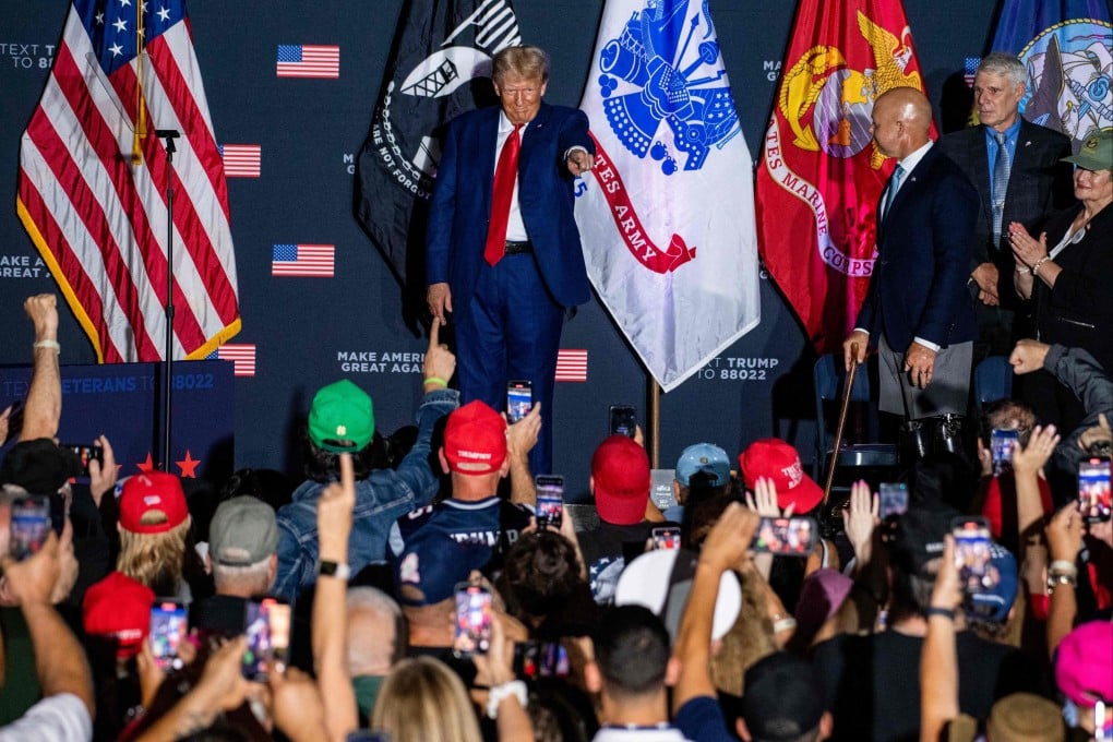 Former US president and 2024 presidential hopeful Donald Trump arrives to speak during a campaign rally at Windham High School in Windham, New Hampshire. Despite his many legal troubles and 2020 loss, Trump remains the choice of many Republican voters. Photo: AFP
