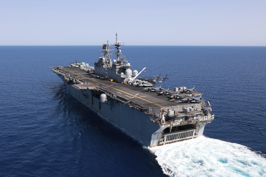 The amphibious assault ship USS Bataan travels through the Red Sea on August 8. Western-backed maritime forces in the Middle East on Saturday warned shippers travelling through the strategic Strait of Hormuz to stay as far away from Iranian territorial waters as possible to avoid being seized. Photo: Mass Communication Specialist 3rd Class Riley Gasdia / US Navy via AP