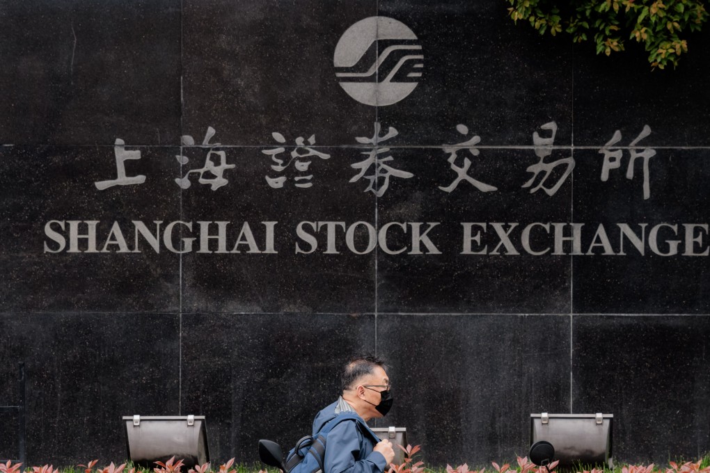 A man passes the Shanghai Stock Exchange Building in Shanghai on April 3, 2023. Photo: EPA-EFE