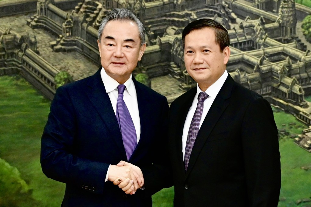 Hun Manet, designated as Cambodia new prime minister, right, shakes hands with Chinese Foreign Minister Wang Yi , during a meeting at the Peace Palace in Phnom Penh, Cambodia on Sunday, August 13, 2023. Wang Yi is on an official visit in Cambodia to tighten ties and cooperation between the two countries.  Photo: EPA-EFE